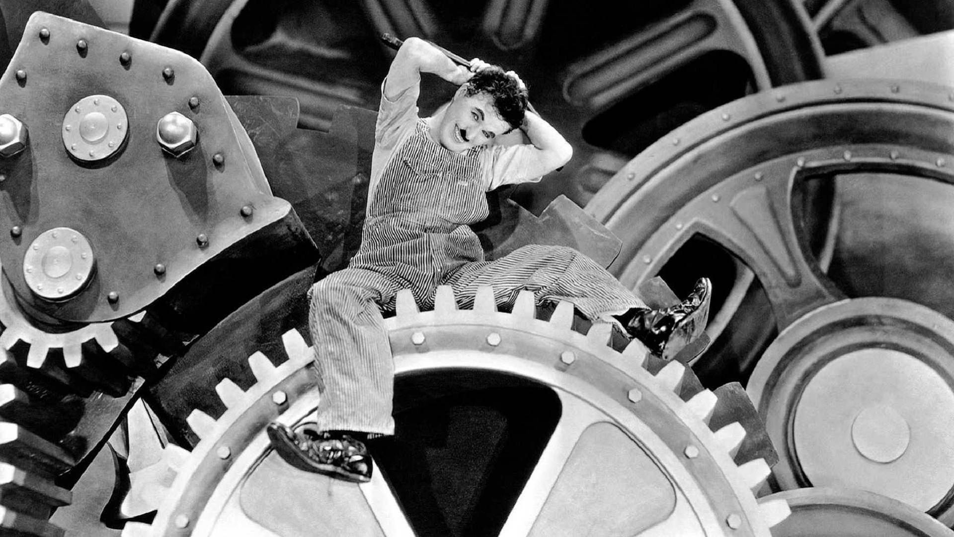 چارلی چاپلین سوار بر چرخ دنده در فیلم  سیاه سفید عصر مدرن
