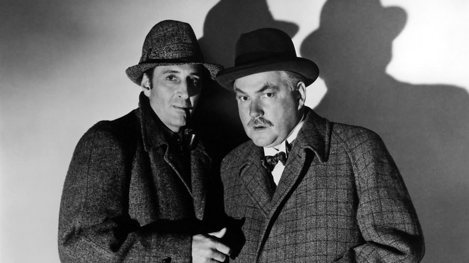 بازیل راتبون و نیگل بروس در تصویری سیاه و سفید از فیلم The Hound of the Baskervilles