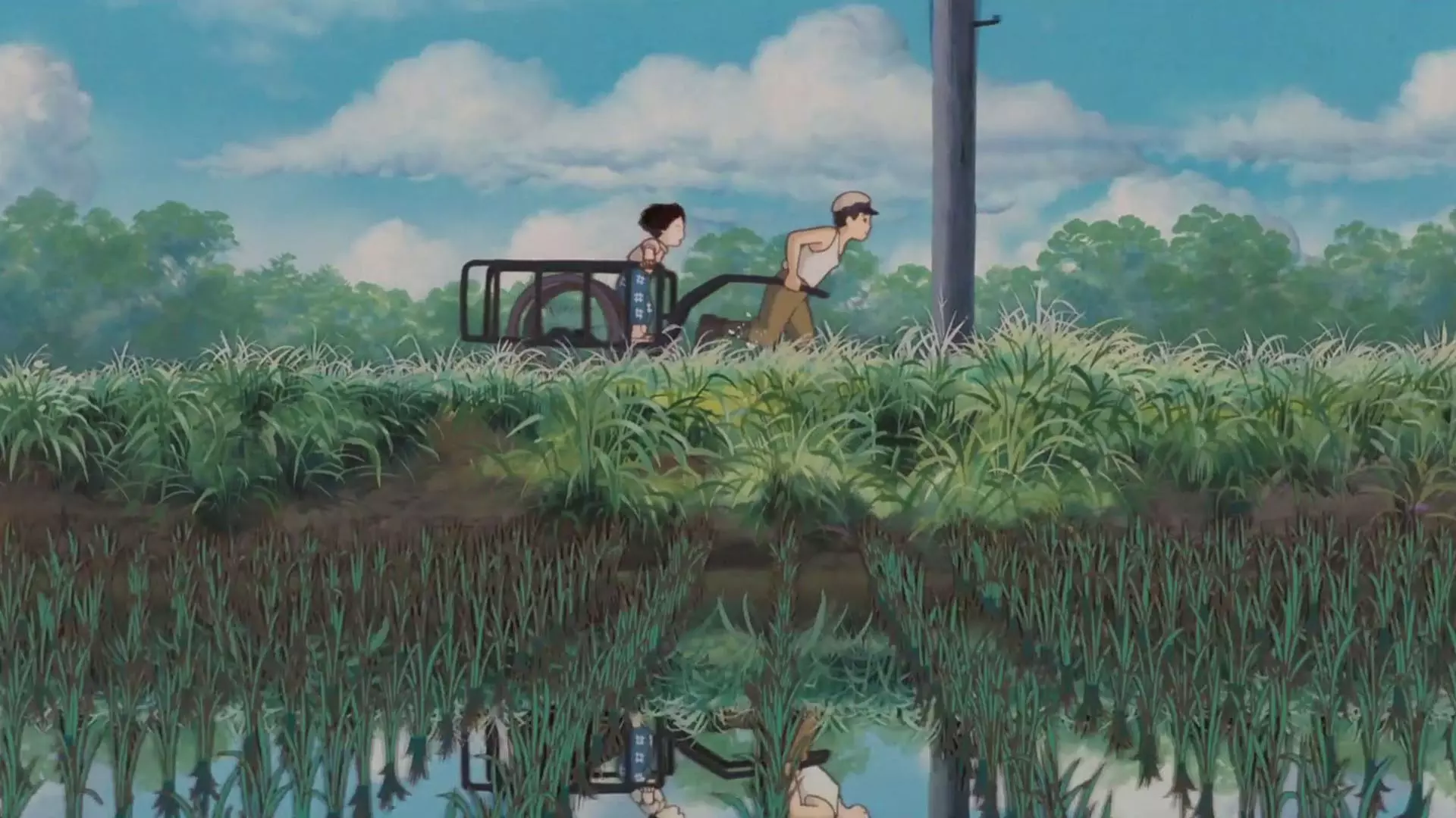 شخصیت سیتا و ستسوکو در مزرعه‌ای در حال کار در انیمه Grave of the Fireflies
