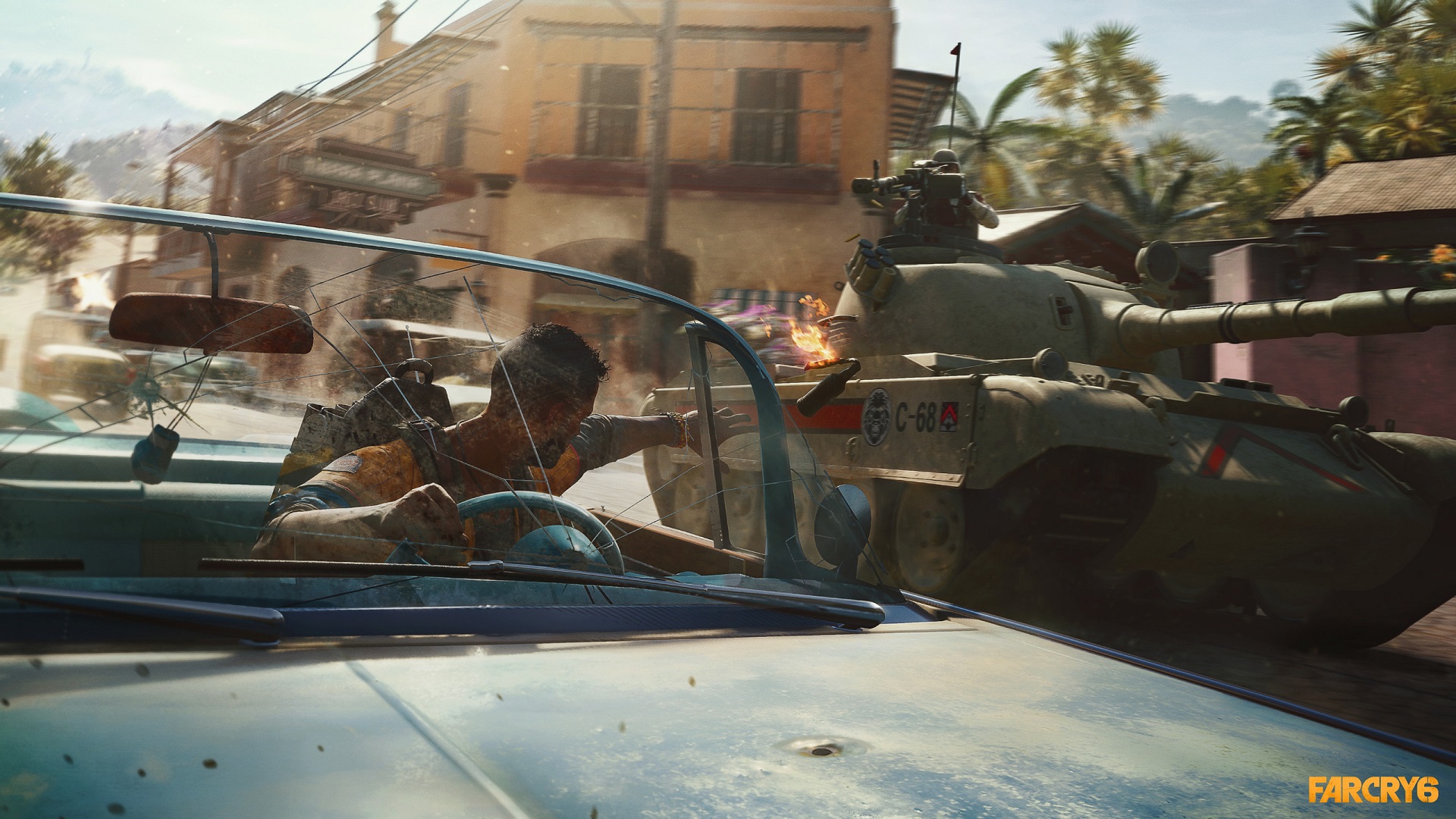 گیم پلی بازی Far Cry 6 و شخصیت در حل شلیک از داخل ماشین در حال حرکت به سمت تانگ وسط خیابان شهر