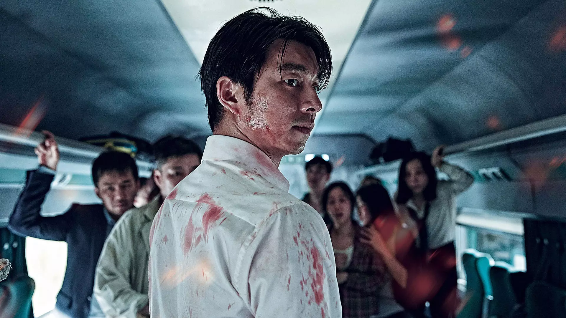 مرد آسیایی خون آلود به پشت سر نگاه می‌کند فیلم قطار بوسان