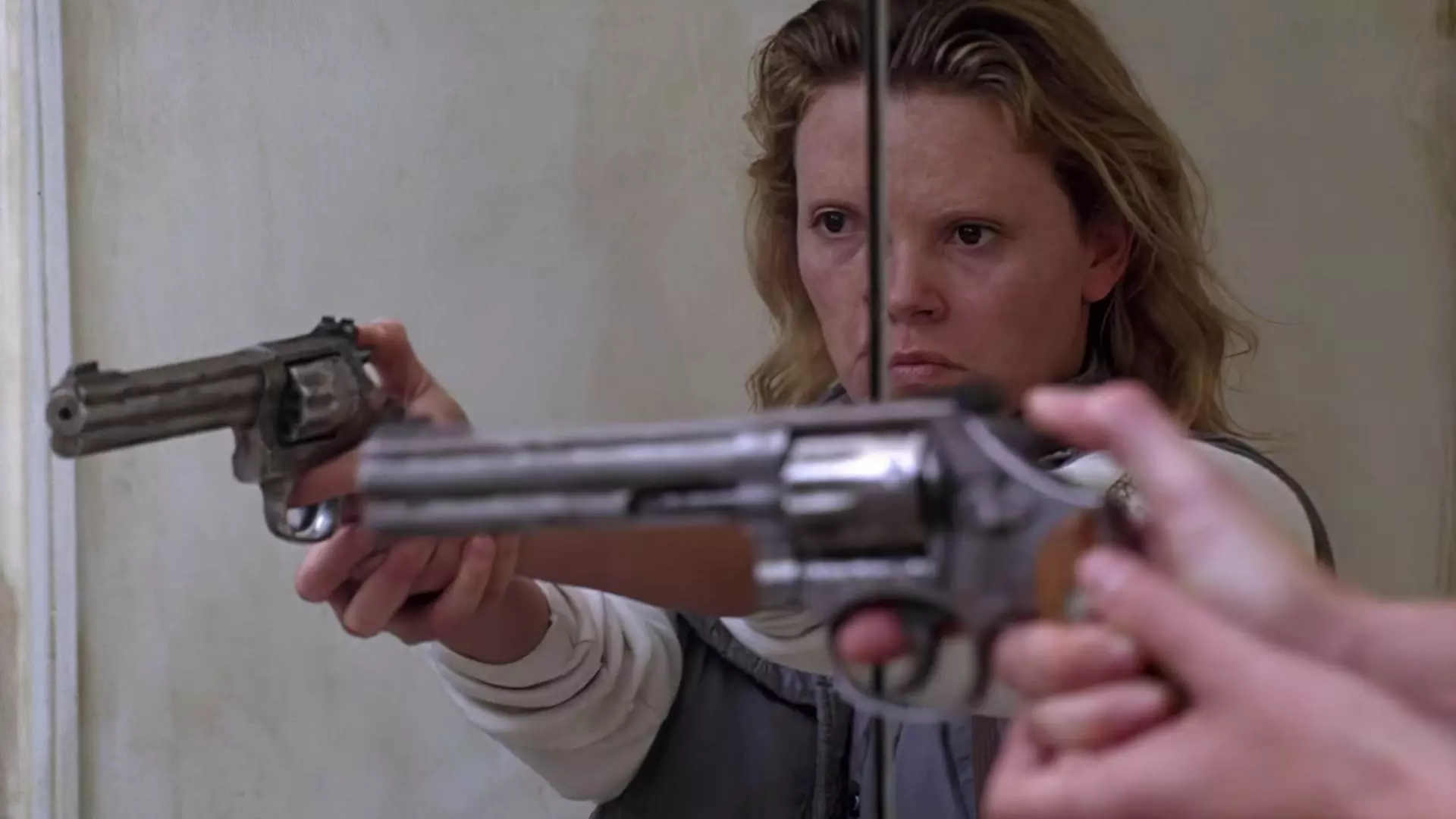 Charlize Theron is aiming her gun Monster movie