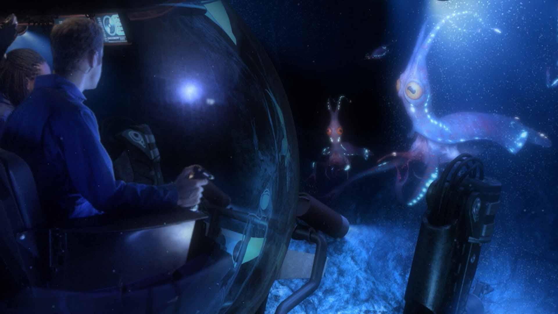دو محقق در زیردریایی مخصوص در حال تماشای آبزی‌ها در فیلم Aliens of the Deep