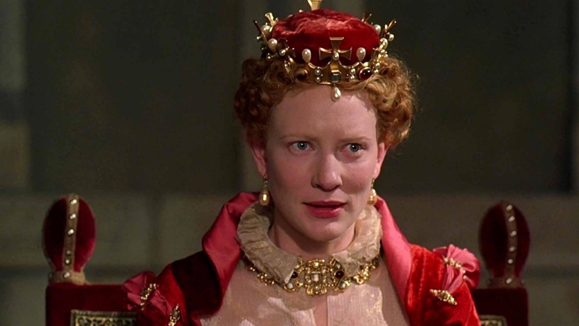 کیت بلانشت با لباس ملکه روی تخت سلطنت در فیلم Elizabeth