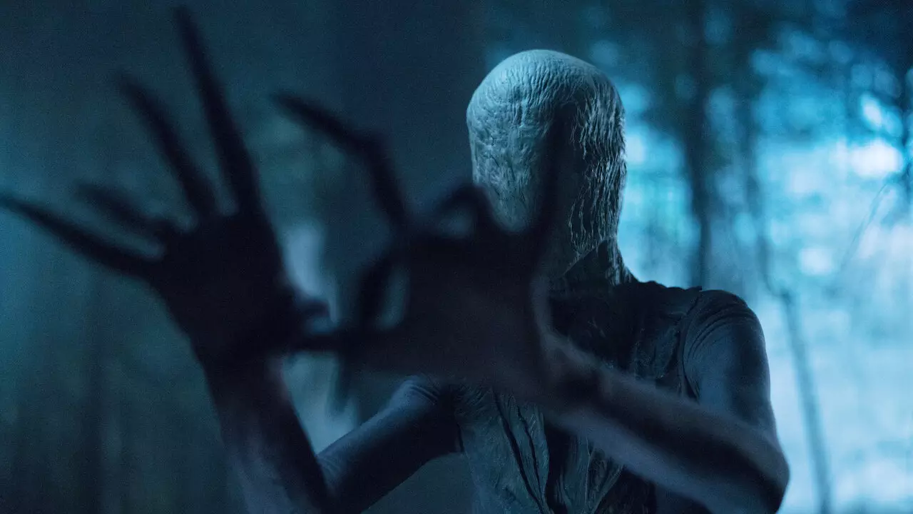 An image of a faceless Slenderman with hands in the shape of dry branches