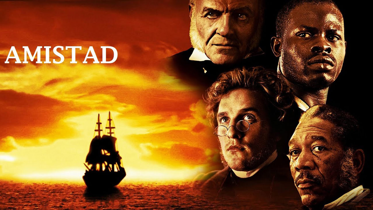 مورگان فریمن،متیو مک کانهی و سر آنتونی هاپکینز در فیلم آمیستاد با پس زمینه کشتی در میان دریا و غروب خورشید