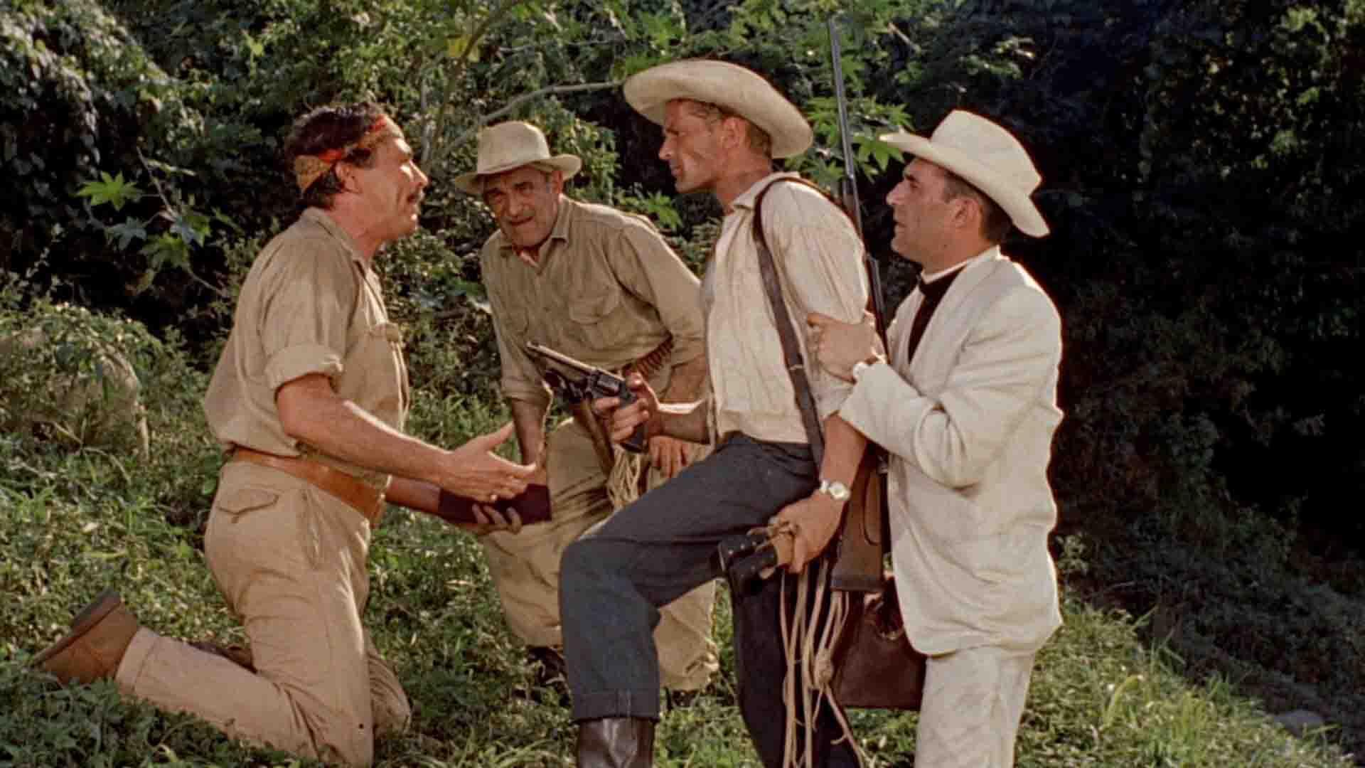 چند مرد به همراه اسلحه در فیلم Death in the Garden در جنگل